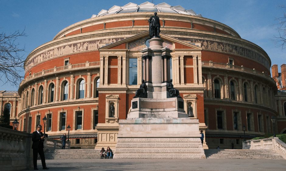 View of the historic Royal Albert Hall with foreground monument in London, UK.